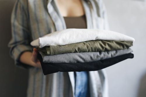 A stack of neatly folded t-shirts