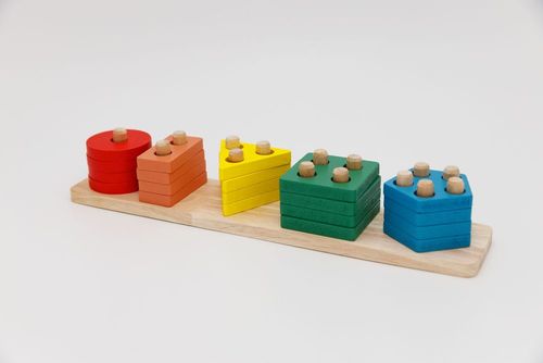 Colourful wooden stacking toy on a stand